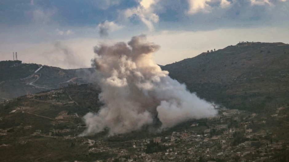 Smoke rises from the site of controlled explosions during demolition activities by the Israeli army in the southern Lebanese village of Kfar Kila