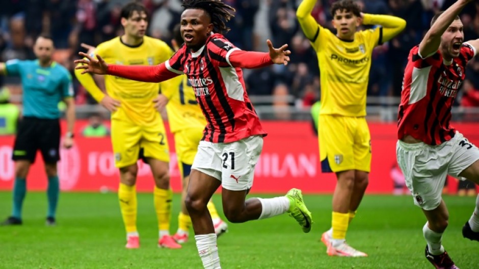 AC Milan's Nigerian midfielder Samuel Chukwueze (C) celebrates scoring his team's third goal against Parma at the San Siro Stadium in Milan