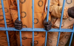 File: Inmates stand behind bars in The Maximum Security Section, of The Leeuwkop Correctional Facility, Bryanston.