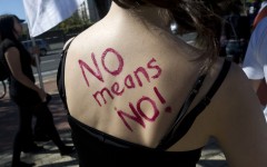 File: "No means No " is written on the back of a woman. AFP/STR