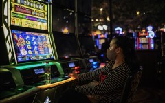 A woman gambles at the Montecasino complex after government allowed casinos, cinemas and restaurants to resume their activity.