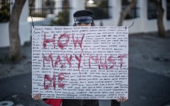 File: A woman protesting GBV. AFP/Marco Longari