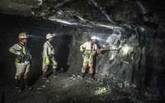 Miners busy with operations during their shift. AFP/Mujahid Safodien