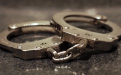 File: A pair of handcuffs on a table. Getty Images/James C Hooper