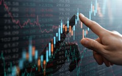 File: Candlestick chart and data of financial market. GettyImages/tadamichi