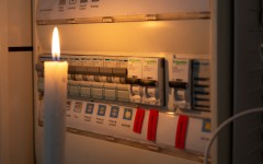 File: A candle next to an electricity meter. AFP/Valerie Dubois/Hans Lucas