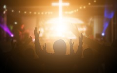 File: People listening to worship music. GettyImages/arkira