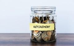 A bottle filled with coins for retirement. GettyImages/Nora Carol Photography