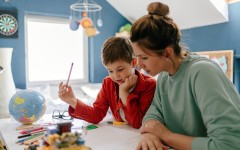 File: A young boy being homeschooled by his mother. GettyImages/AleksandarNakic