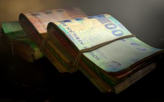 A close-up view of stacks of South African rand banknotes. GettyImages/allanswart