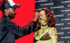 An artist painting a performer at Comic Con Africa. Facebook/Comic Con Africa