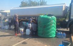 Joburg residents fetching water from a roaming tank. eNCA/Bafedile Moerane