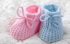 File: Blue and pink baby booties. GettyImages/egal