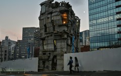 Pedestrians walk past the four-storey Arimaston Building created by Japanese architect Keisuke Oka in Tokyo