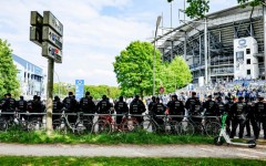 Police forces stand guard outside the Volksparkstadion in Hamburg. 