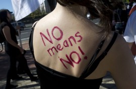 File: "No means No " is written on the back of a woman. AFP/STR