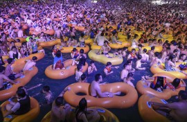 The popular Wuhan Maya Beach Water Park was filled with people frolicking in swimsuits and goggles for an electronic music festival.