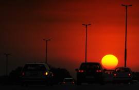 Drivers ride their cars along a highway during sunset in Johannesburg.