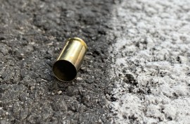 File: A bullet casing at a crime scene. GettyImages/christelista