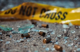 File: Bullet casings and broken glass at a crime scene. GettyImages/D-Keine