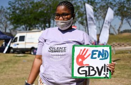 File: A student with End GBV sign at the 10th Annual Silent Protest March. Darren Stewart/Gallo Images via Getty Images