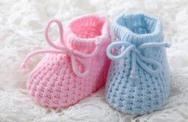 File: Blue and pink baby booties. GettyImages/egal