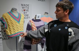 Retired British Olympic diving champion Tom Daley returned to Tokyo, where he won Olympic gold three years ago, to open a showcase of his knitting and crocheting