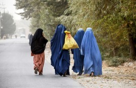 Afghan women walk in the outskirts of the northern city of Mazar-i-Sharif in October 2024