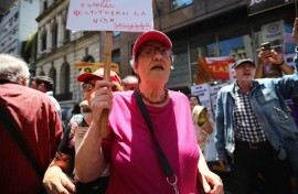 Alicia Ceresoli, an 80-year-old pensioner, protests outside the headquarters of PAMI, the agency that manages retiree benefits, in Buenos Aires on December 4, 2024