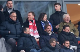 Jurgen Klopp (2ndR C) sits next to former Germany forward Mario Gomez (R) in RB Leipzig's 4-2 win over Werder Bremen