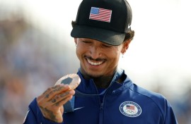 Nyjah Huston holds his bronze medal after the victory ceremony for the men's street skateboarding event on July 29, 2024