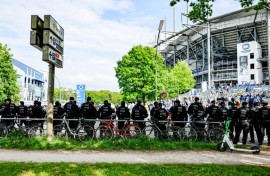 Police forces stand guard outside the Volksparkstadion in Hamburg. 