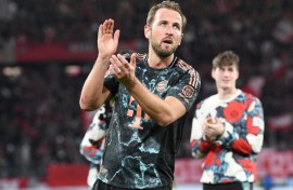 On target: Harry Kane celebrates after Bayern's win over Freiburg on Saturday