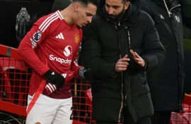 Manchester United's coach Ruben Amorim (R) pictured talking to Antony, who has joined Real Betis on loan