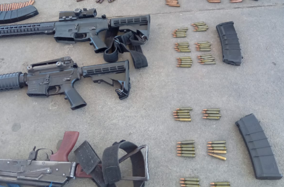 Firearms -- including scores of ammunition and magazines -- were seized. Twitter/@SAPoliceService