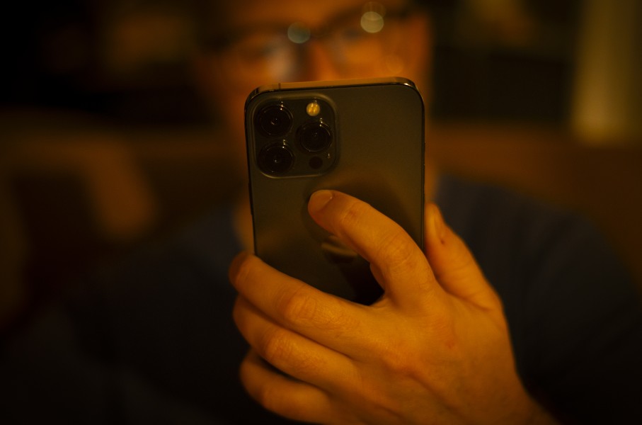 A man is seen using a mobile phone. 