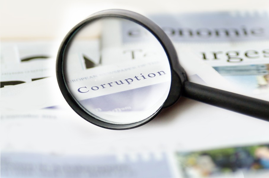 The word corruption seen on a piece of paper. Getty Images/TheaDesign