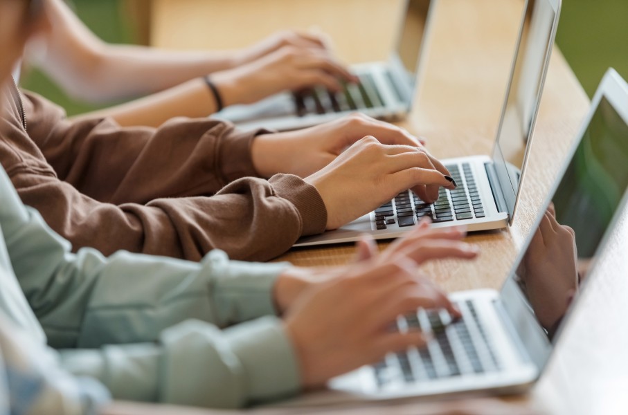 File: Children working on laptops. GettyImages/isuzek