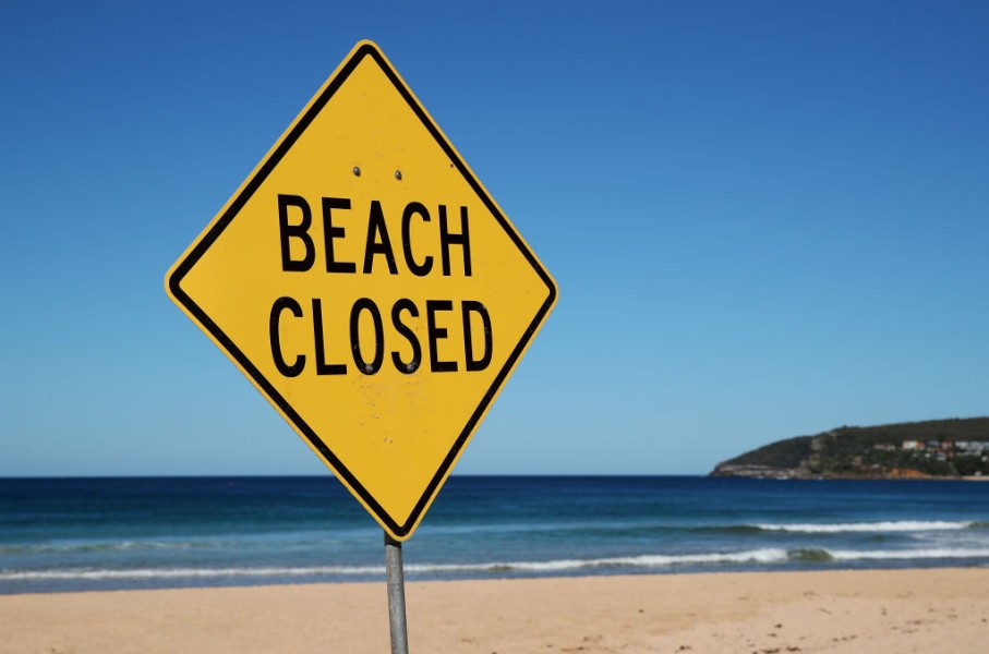 File: A Beach Closed sign. GettyImages/Cameron Spencer