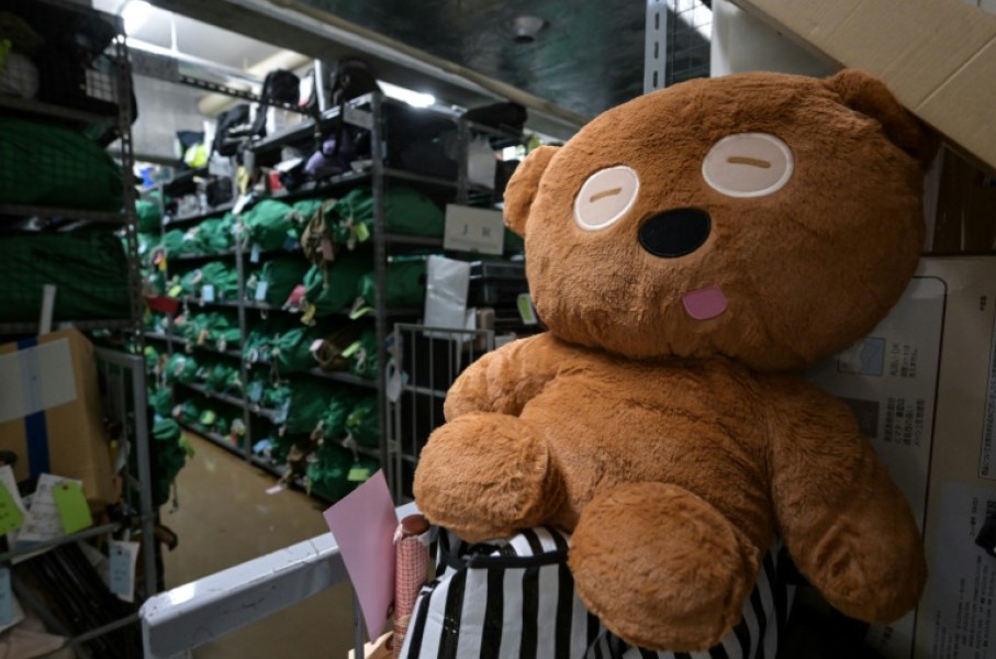 A teddy bear sits amongst thousands of items -- all bagged, tagged and organised based on where and when they were lost - at the Tokyo police department's lost and found centre