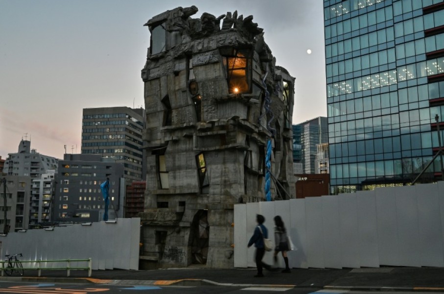 Pedestrians walk past the four-storey Arimaston Building created by Japanese architect Keisuke Oka in Tokyo