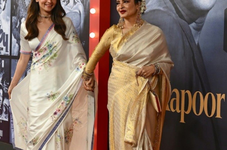 Bollywood actors Alia Bhatt (L) and Rekha at an event marking the 100th birth anniversary of legendary Indian actor and filmmaker Raj Kapoor