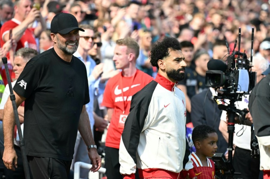 Jurgen Klopp walks out with Mohamed Salah before the German's final match in charge of Liverpool last May