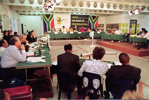 File: Winnie Madikizela-Mandela flanked by her legal representatives at the Truth and Reconciliation Commission (TRC) hearing in Johannesburg on 24 November. ODD ANDERSEN / AFP