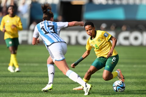 Argentina's defender #13 Sophia Braun (L) fights for the ball with South Africa's forward #08 Hildah Magaia during the Australia and New Zealand 2023 Women's World Cup Group G football match between Argentina and South Africa at Dunedin Stadium in Dunedin on July 28, 2023. (Sanka Vidanagama / AFP)