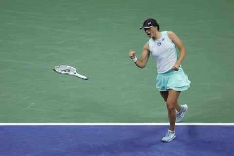 Iga Swiatek celebrates reaching the US Open final with victory over Aryna Sabalenka in the semi-finals