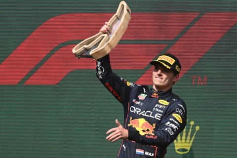 Max Verstappen celebrates his victory on the podium at the Belgian Grand Prix in August