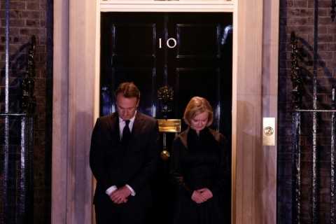 Prime Minister Liz Truss observed the national moment of reflection on the steps of Downing Street