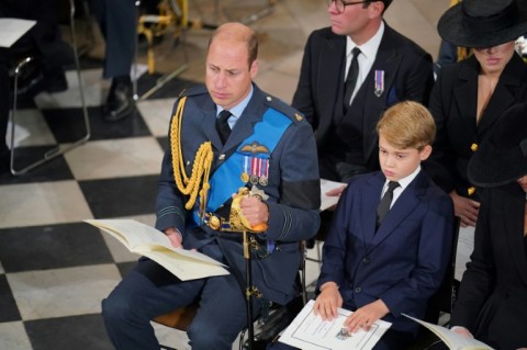 The Prince of Wales sat beside his eldest son Prince George during Queen Elizabeth II's funeral service