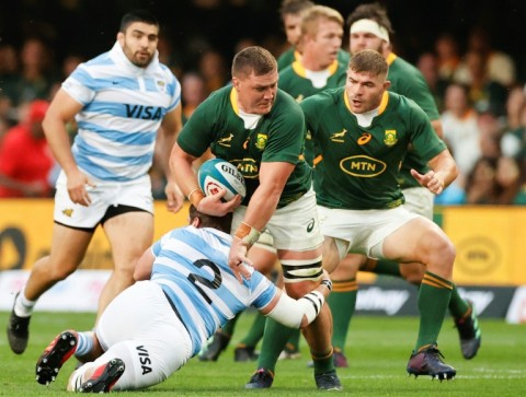 South Africa No. 8 Jasper Wiese (C) is tackled by Argentina hooker Julian Montoya